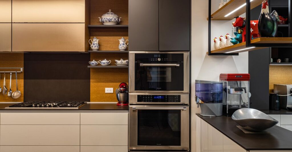 Contemporary kitchen design featuring sleek cabinets, dual ovens, and chic decor.