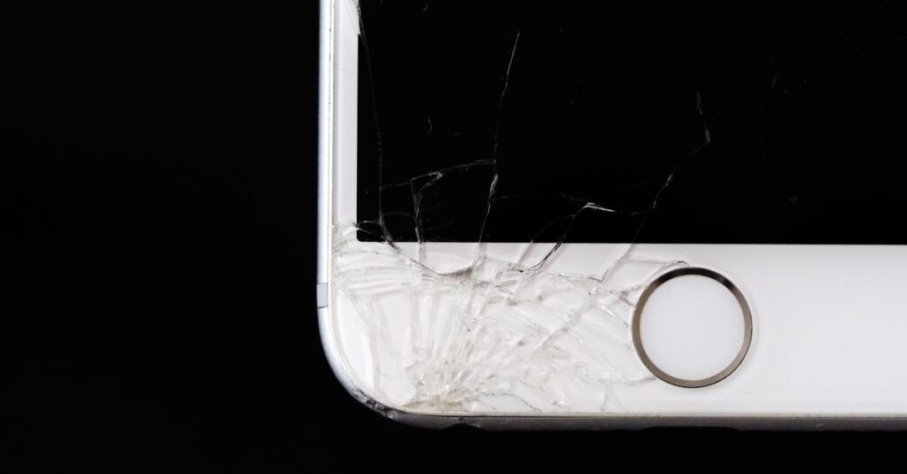 Detailed image of a cracked smartphone screen highlighting damage to the device.