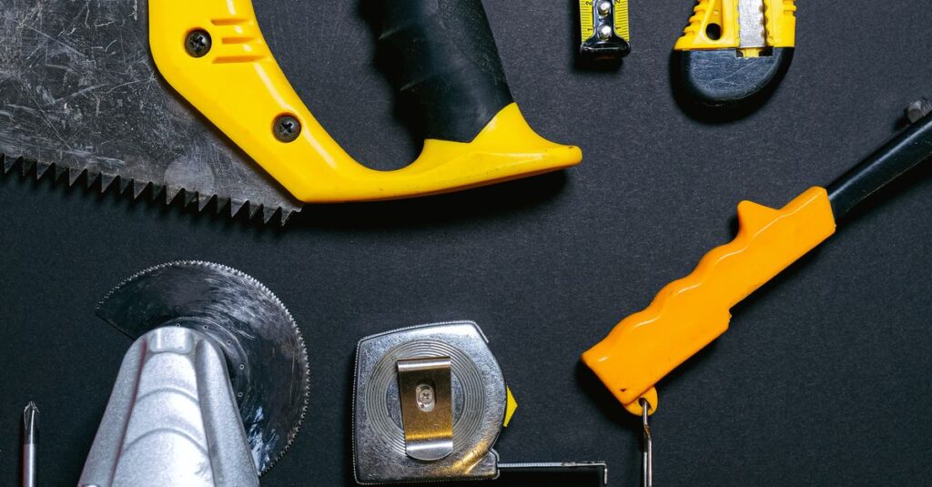 A collection of yellow and black construction tools arranged on a dark flat surface, ideal for DIY projects.