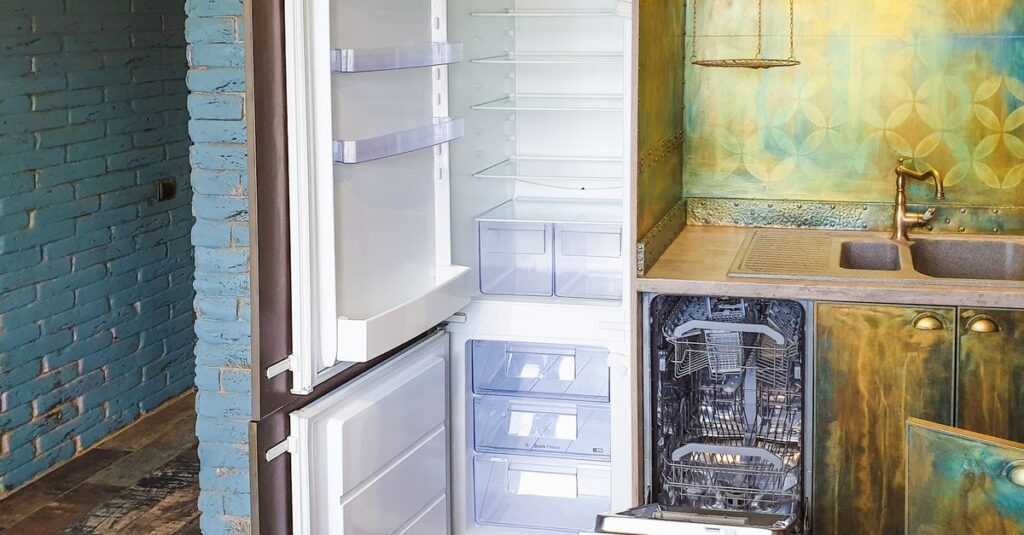 Stylish kitchen interior featuring an open refrigerator and dishwasher, showcasing contemporary design.